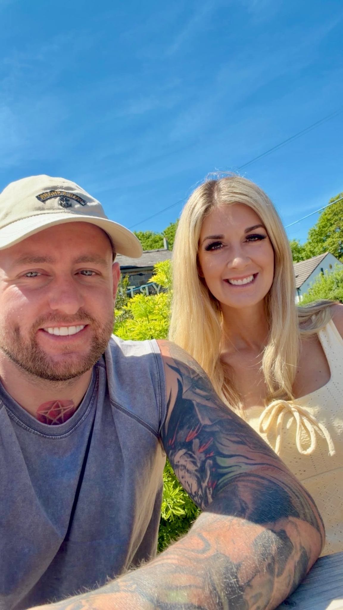 Ash and Tanya smiling outdoors